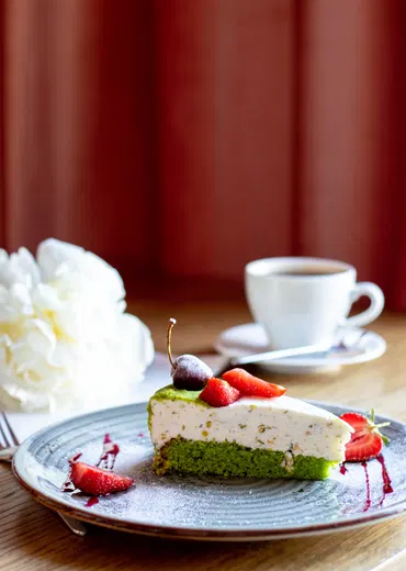 Фисташковый чизкейк в Coffe Club - фото позиции меню кафе